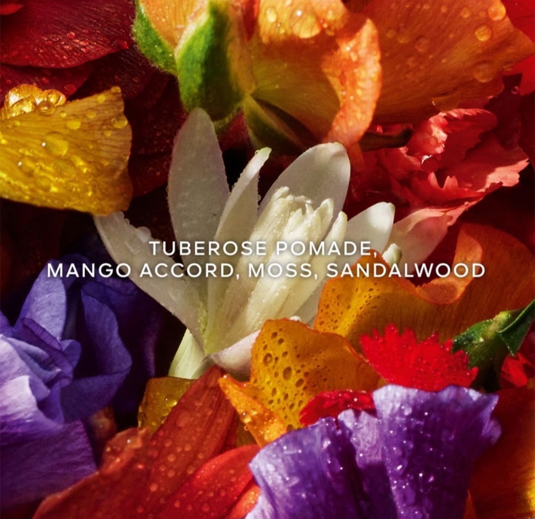 A close-up floral background with colorful tuberose and mango accord, moss, and sandalwood notes, overlaid with the text 'TUBEROSE POMADE, MANGO ACCORD, MOSS, SANDALWOOD' in white.