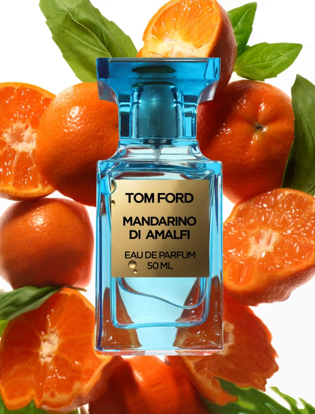 Tom Ford Mandarino Di Amalfi Eau de Parfum bottle, featuring a translucent blue glass body and a beige label, centered against a background of fresh oranges and mint leaves.